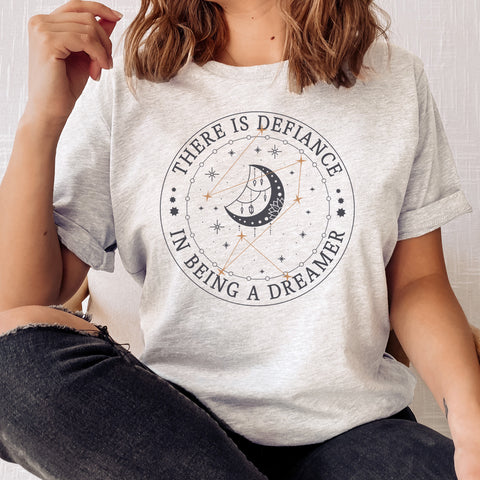 There is defiance in being a dreamer T-Shirt | Addie La Rue